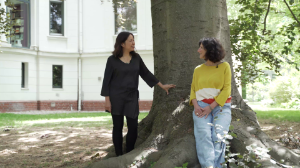 Martina Seeber and Liza Lim standing in front of a tree