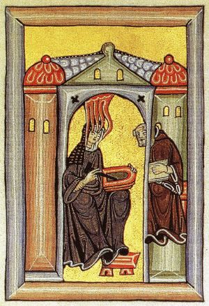 In a medieval illustration, a woman sits in a building. Flames from above reach her head, a scribe stands beside her waiting for instructions.