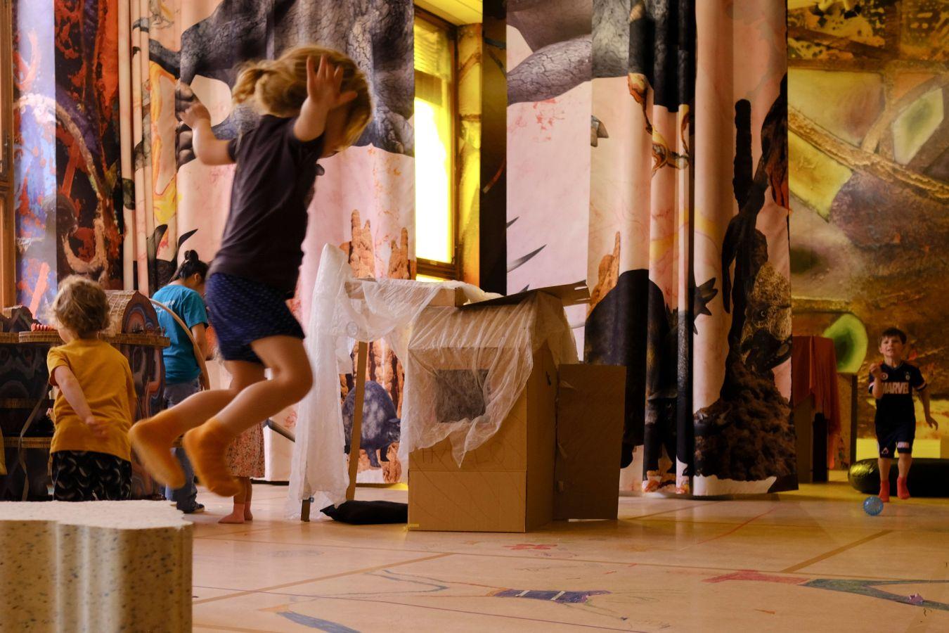 A child is playing in an colourful environment