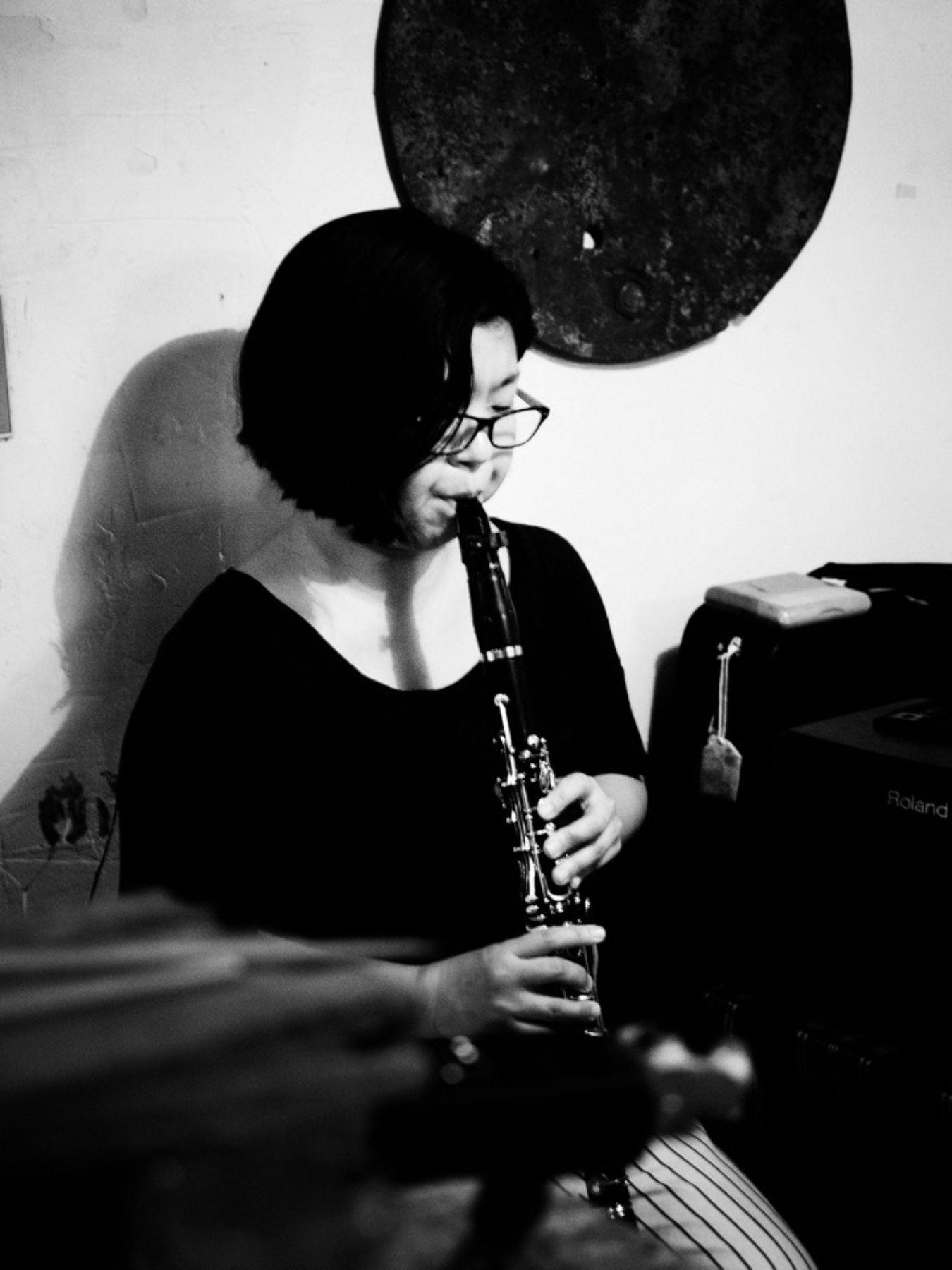 Ogawa plays the clarinet in a crammed room.