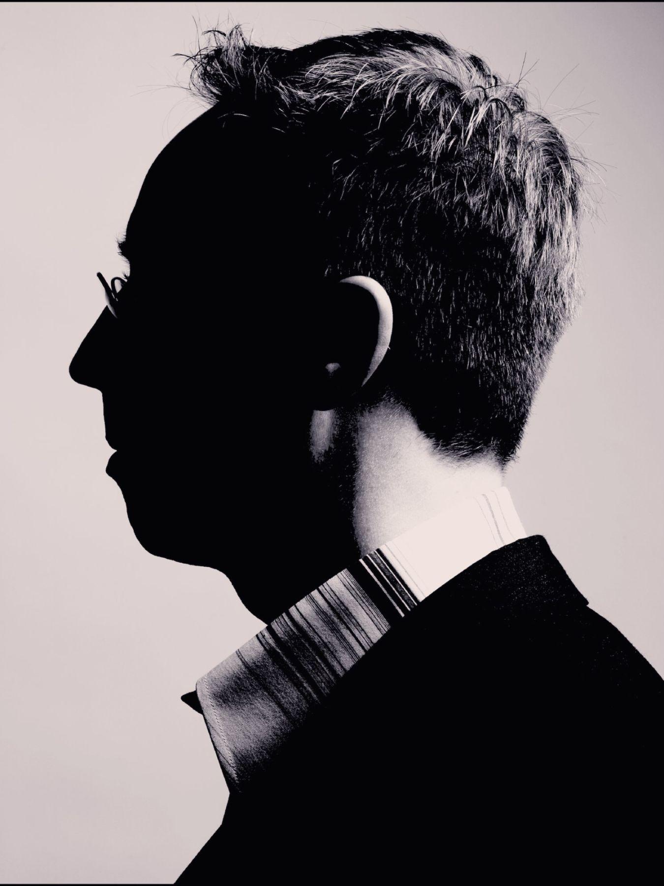 Black and white photo of a man from the side.