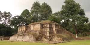 Ruins of a temple in front of trees