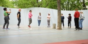 Participants of the International Forum 2024 on the site of “Radical Playgrounds” in front of Gropius Bau.