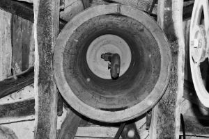 The inside of a church bell seen from below.