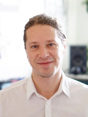 Portrait of a man in front of a bright background