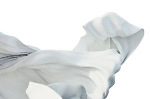 A large white cloth is blowing.