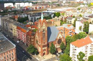 Aerial view of a church made of red brick